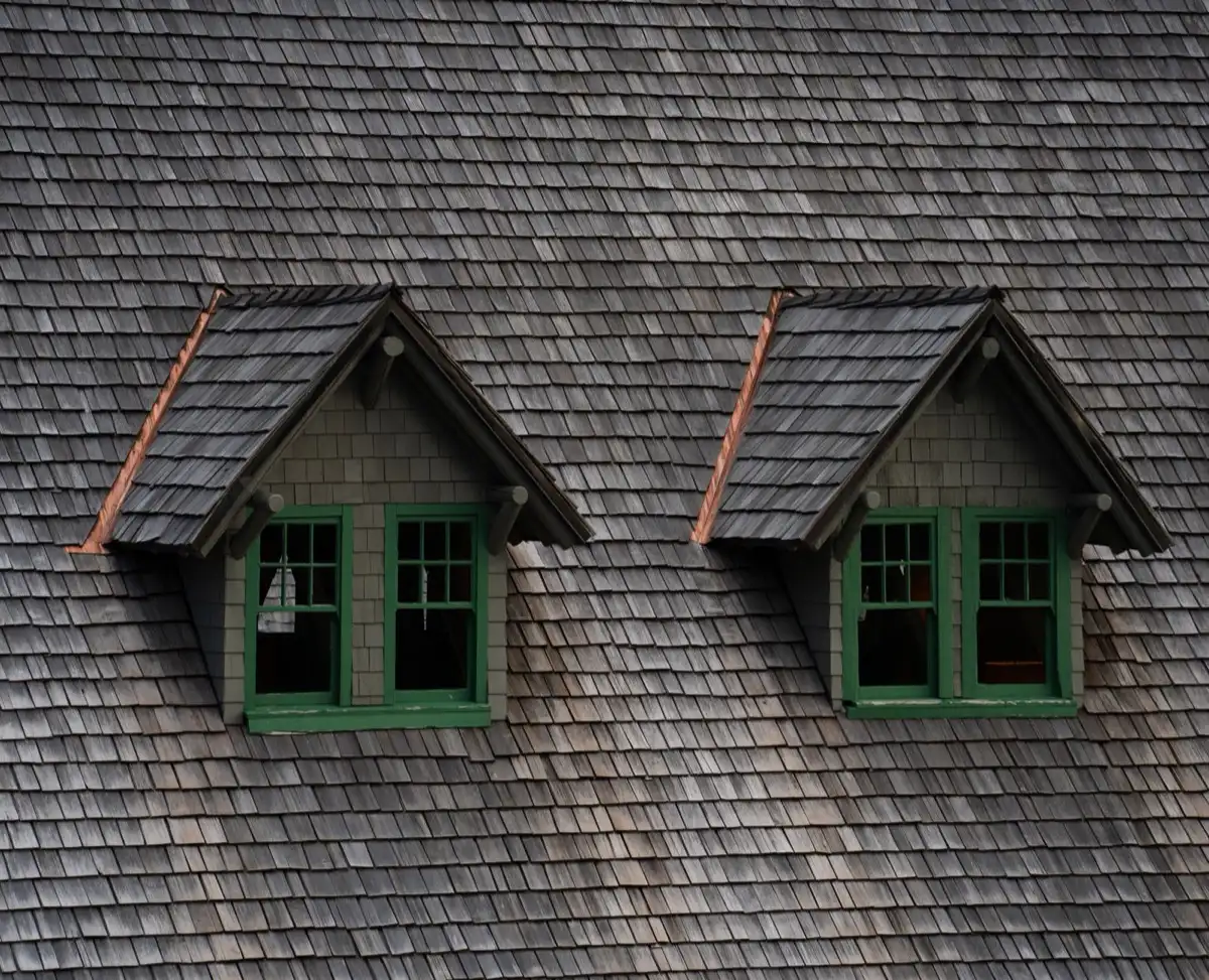 Dormers on a shingle roof in Surprise, AZ, where step flashing and kickout flashing carry water past the walls