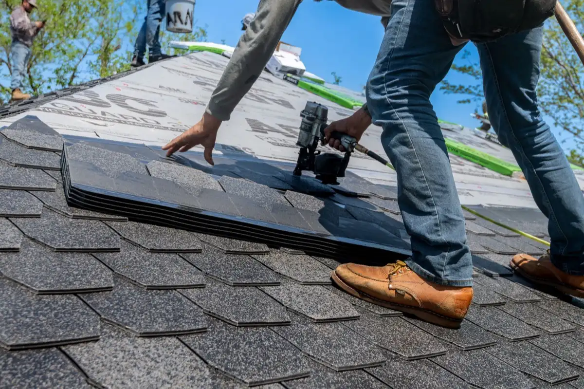 Inspecting an asphalt shingle slope after a hailstorm in Surprise, AZ